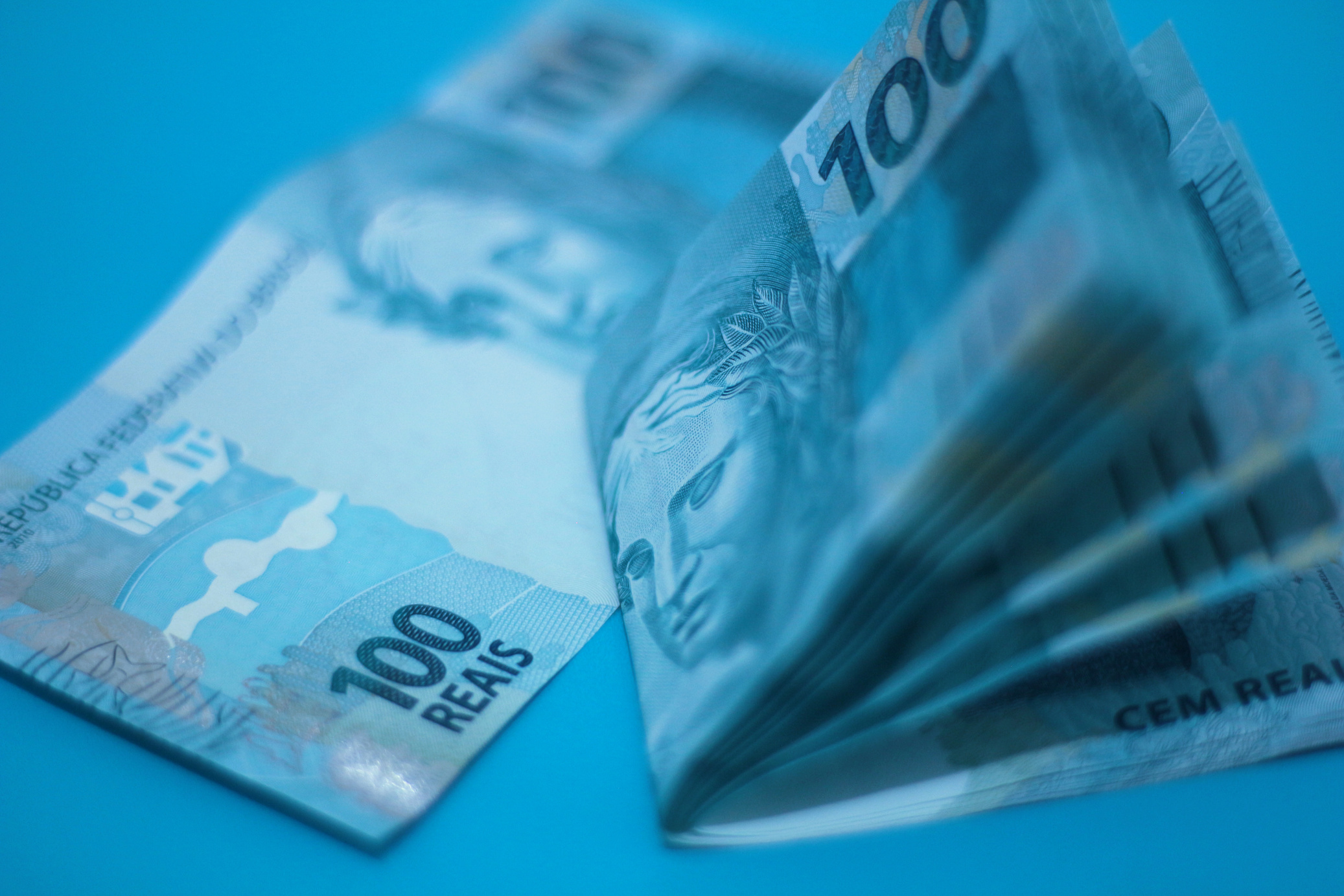 Paper Money on Blue Surface